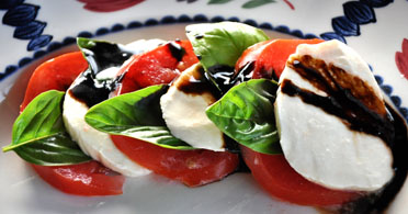 The Real Food Academy Miami caprese salad course with tomatoes and cheese.