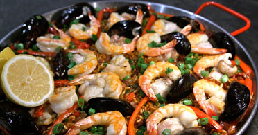 The Real Food Academy Miami seafood, chicken and vegetable paella.