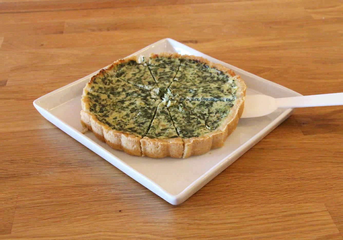 Quiche on a white plate at The Real Food Academy.