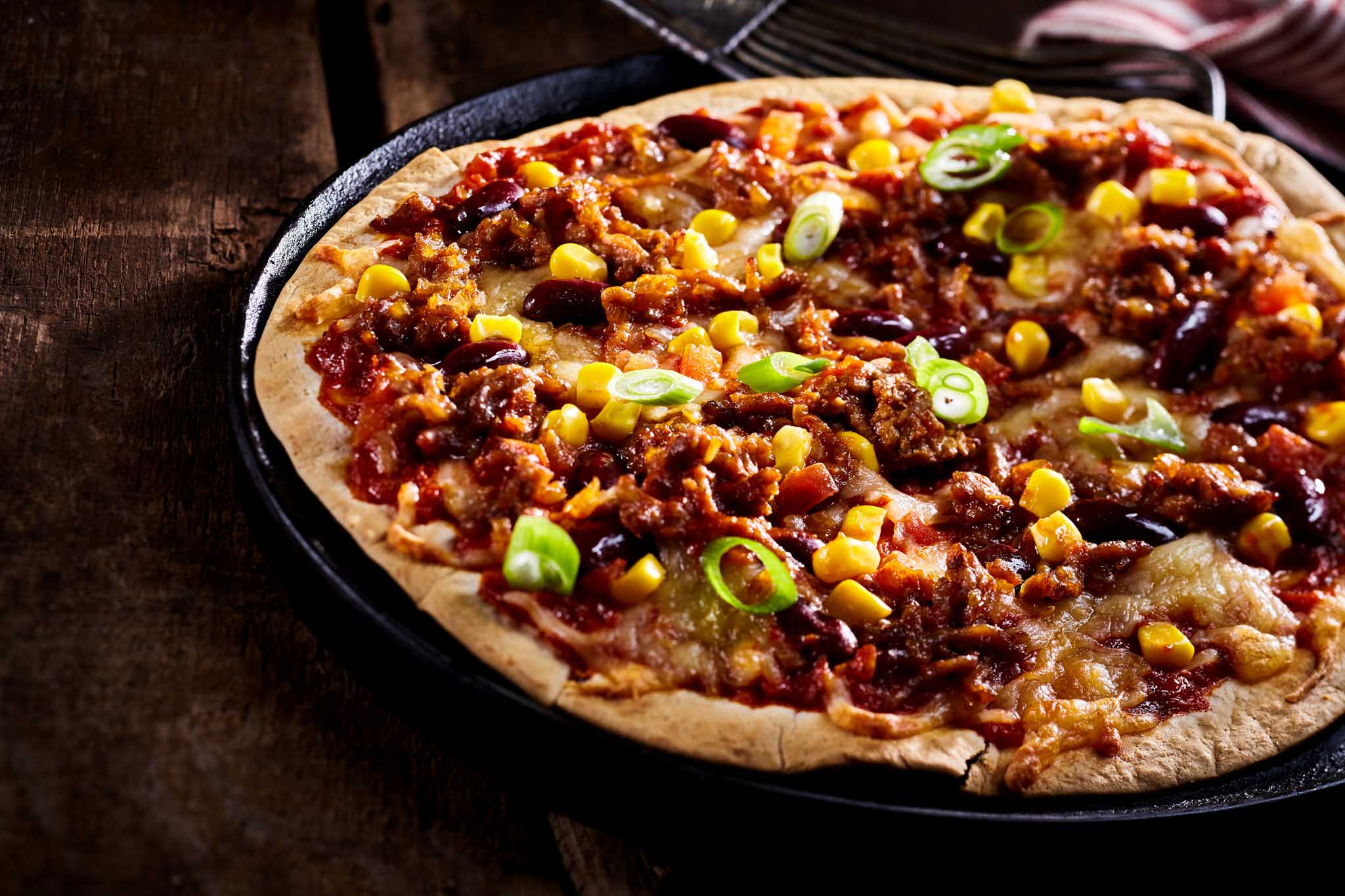 The Real Food Academy fresh made mexican pizza with beans spread.
