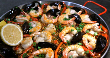 The Real Food Academy Tampa seafood, chicken and vegetable paella.
