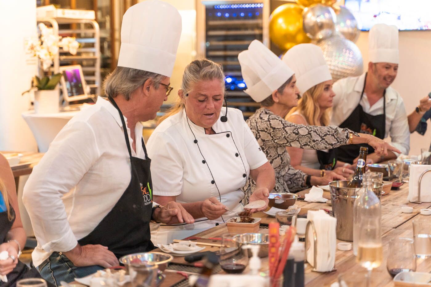 A The Real Food Academy Orlando chef teaching a corporate team at our corporate party venue in Orlando, FL.