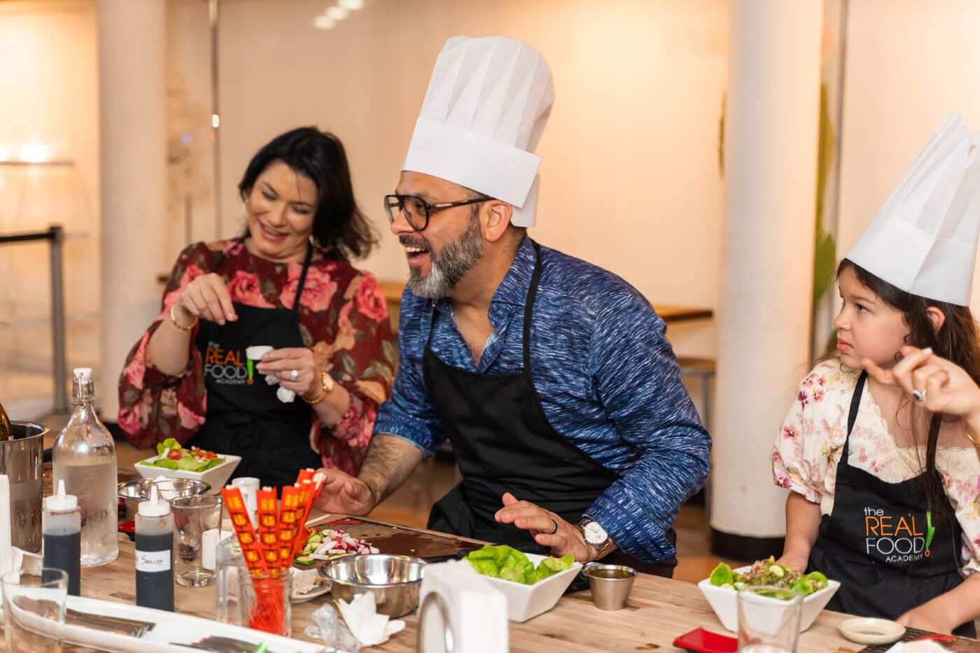 Two adults at healthy cooking classes in Miami, FL with The Real Food Academy. 