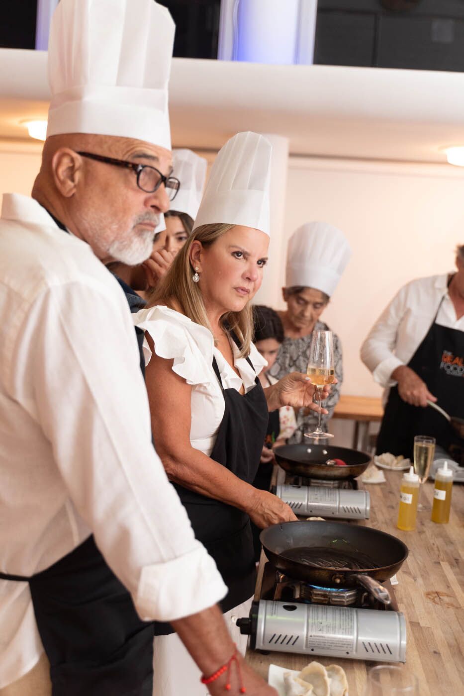 A group of adults at a adult-only The Real Food Academy Miami Valentine's cooking class.