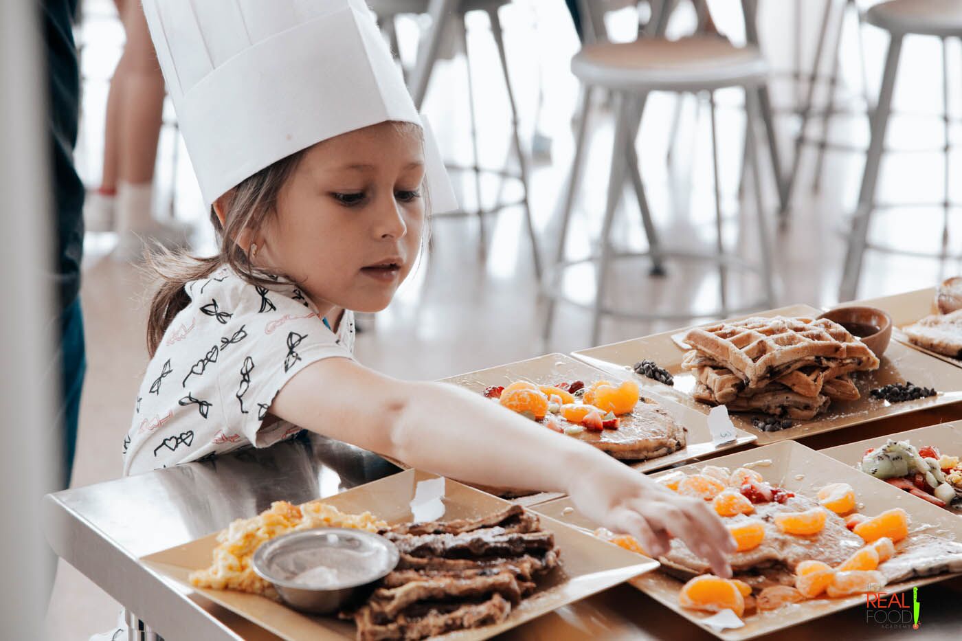 A chef at The Real Food Academy's spring break cooking camp in Orlando, FL.