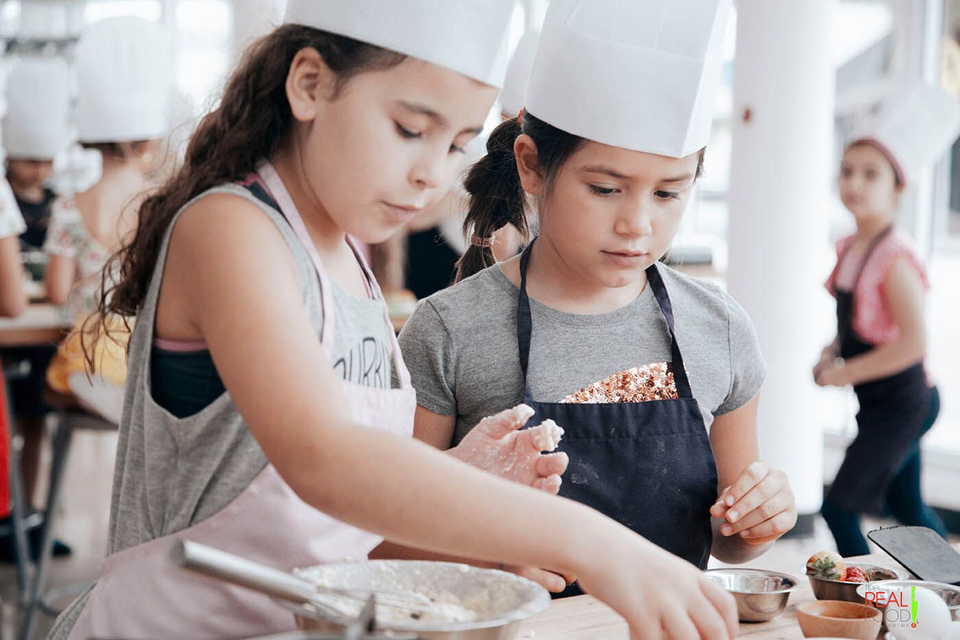 Kids at The Real Food Academy's cooking camps.