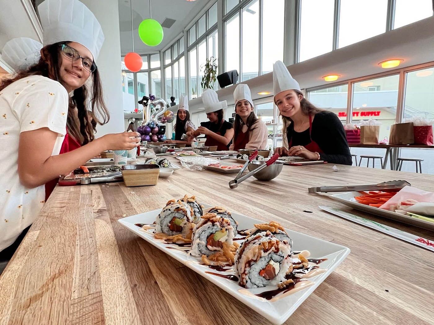 Long table view of a kids party at The Real Food Academy Miami.
