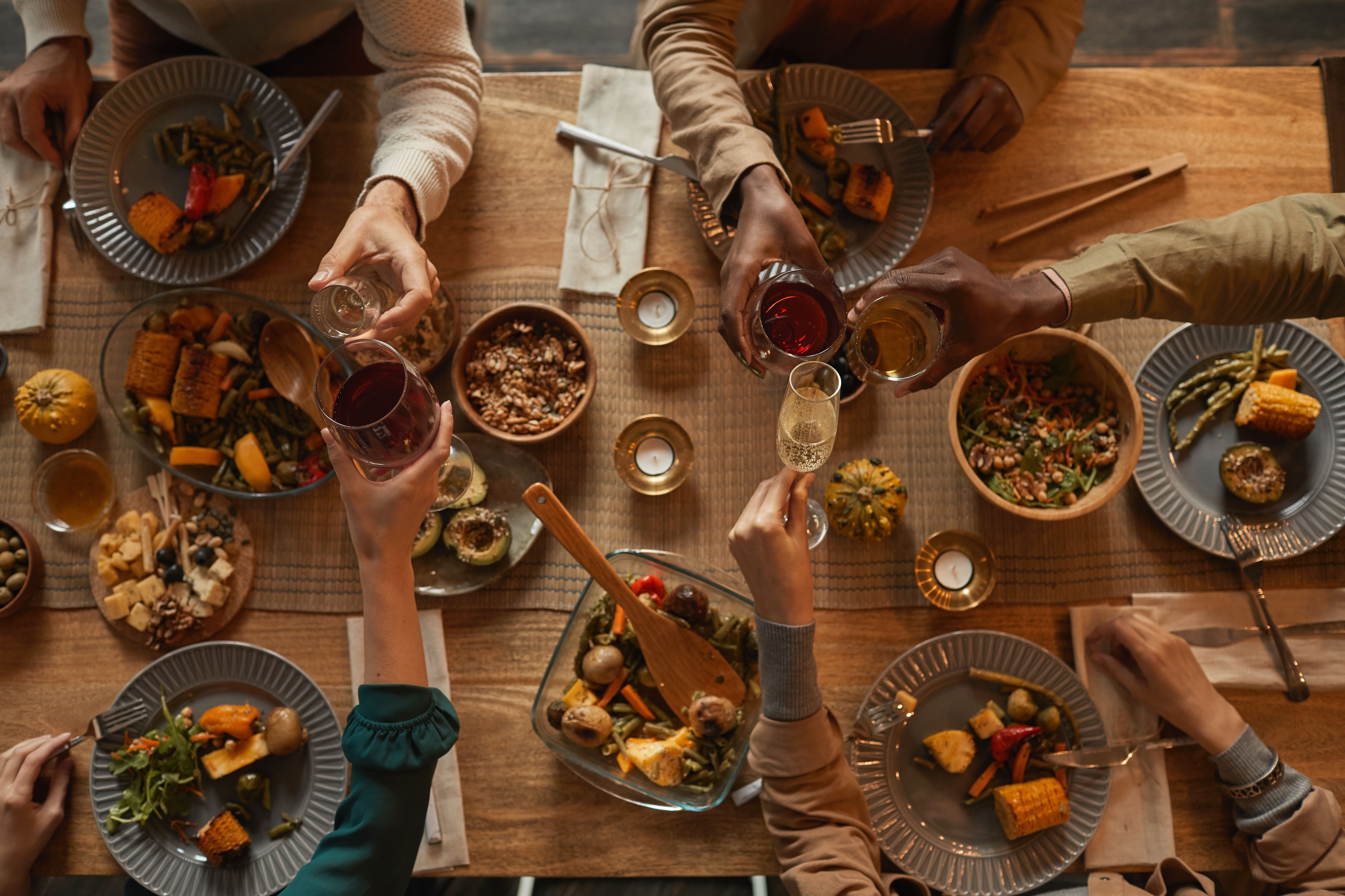 A table filled with healthy, delicious food at a dinner party - learn how to cook for a dinner party with The Real Food Academy Miami!