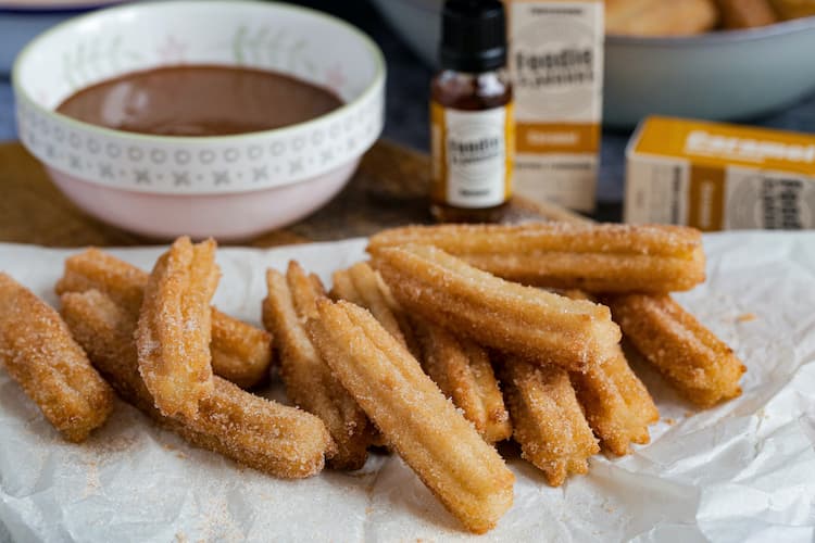 Image of baked churros on parchment paper