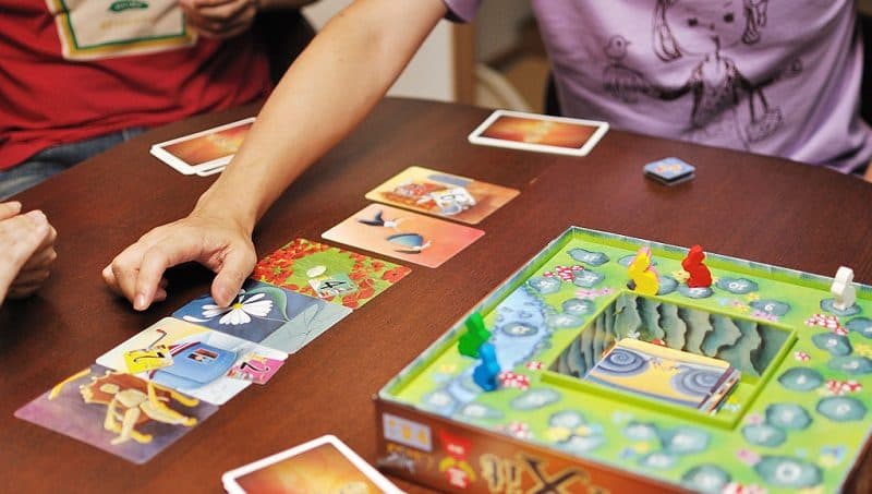 Image of kids playing a board game