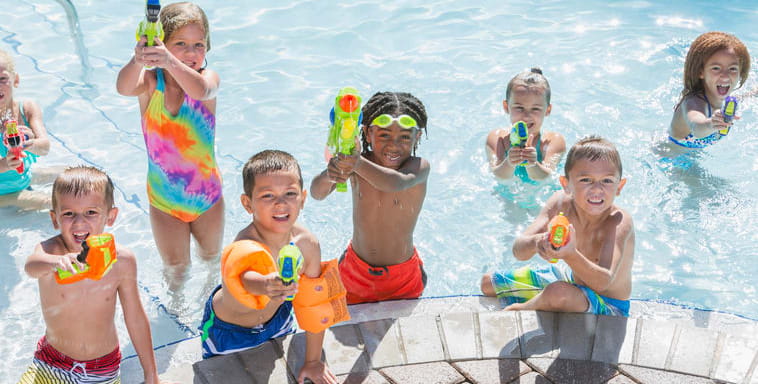 Image of kids playing in the Pool with water toys