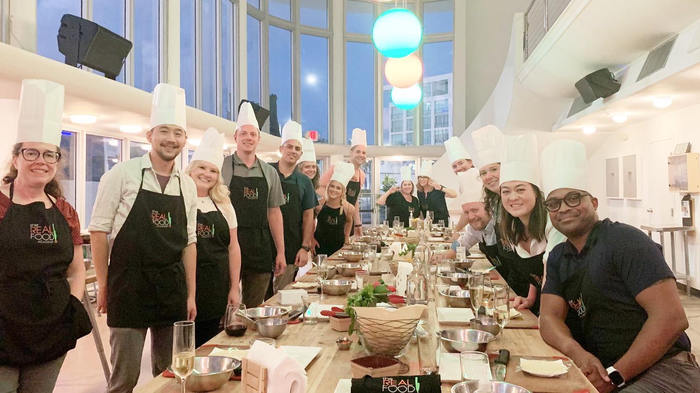 A group of adults at a Real Food Academy cooking class.