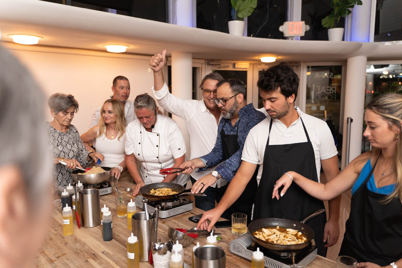 A chef leading one of The Real Food Academy's corporate team building cooking classes in Miami, FL.
