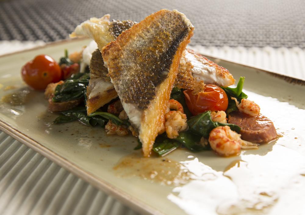The Real Food Academy Miami's pan seared mediterranean seabass with tomato medley recipe.