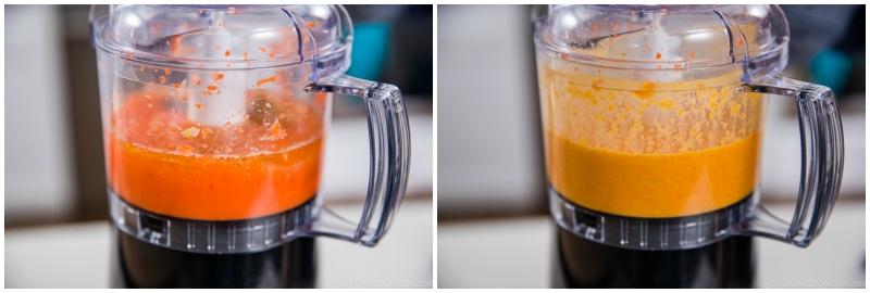 A picture of a salad dressing being blended until smooth.