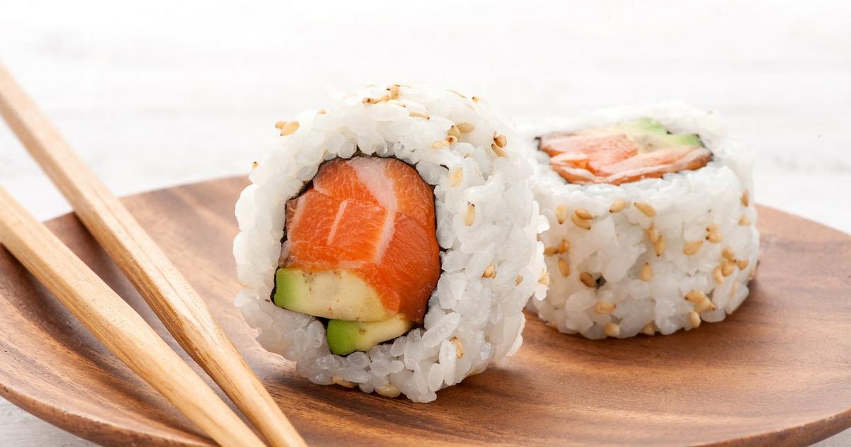 An inside out salmon roll prepared by The Real Food Academy Miami.